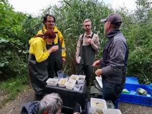 The photo shows Mariia and her fellow students doing practical research in Poland.